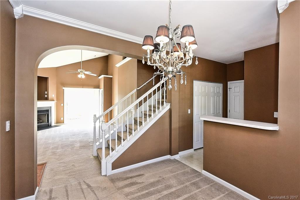 919 Azurine Circle, Unit 69 Fort Mill, SC 29708 - Photo 8 of 22 a view of a hallway with chandelier