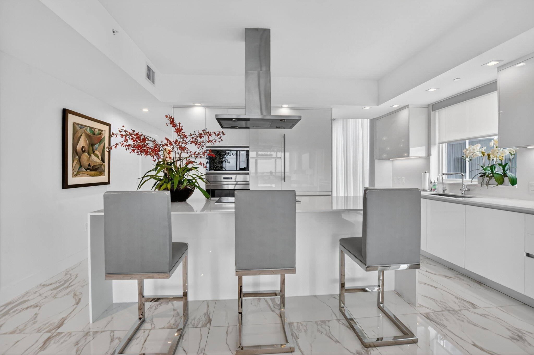 20155 Boca W Drive, Unit B701 Boca Raton, FL 33434 - Photo 18 of 78 a dining room filled chandelier and wooden floor