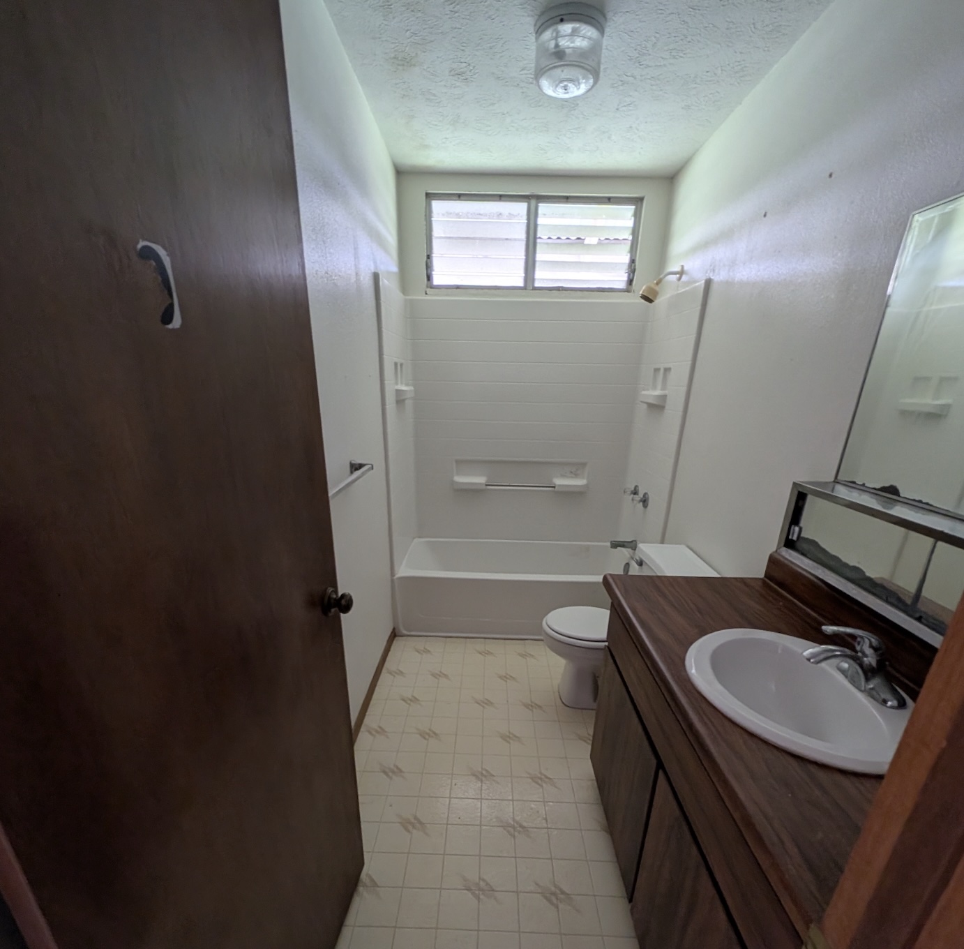 52 Wawai Loop Hilo, HI 96720 - Photo 7 of 18 a bathroom with a sink a toilet a mirror and shower
