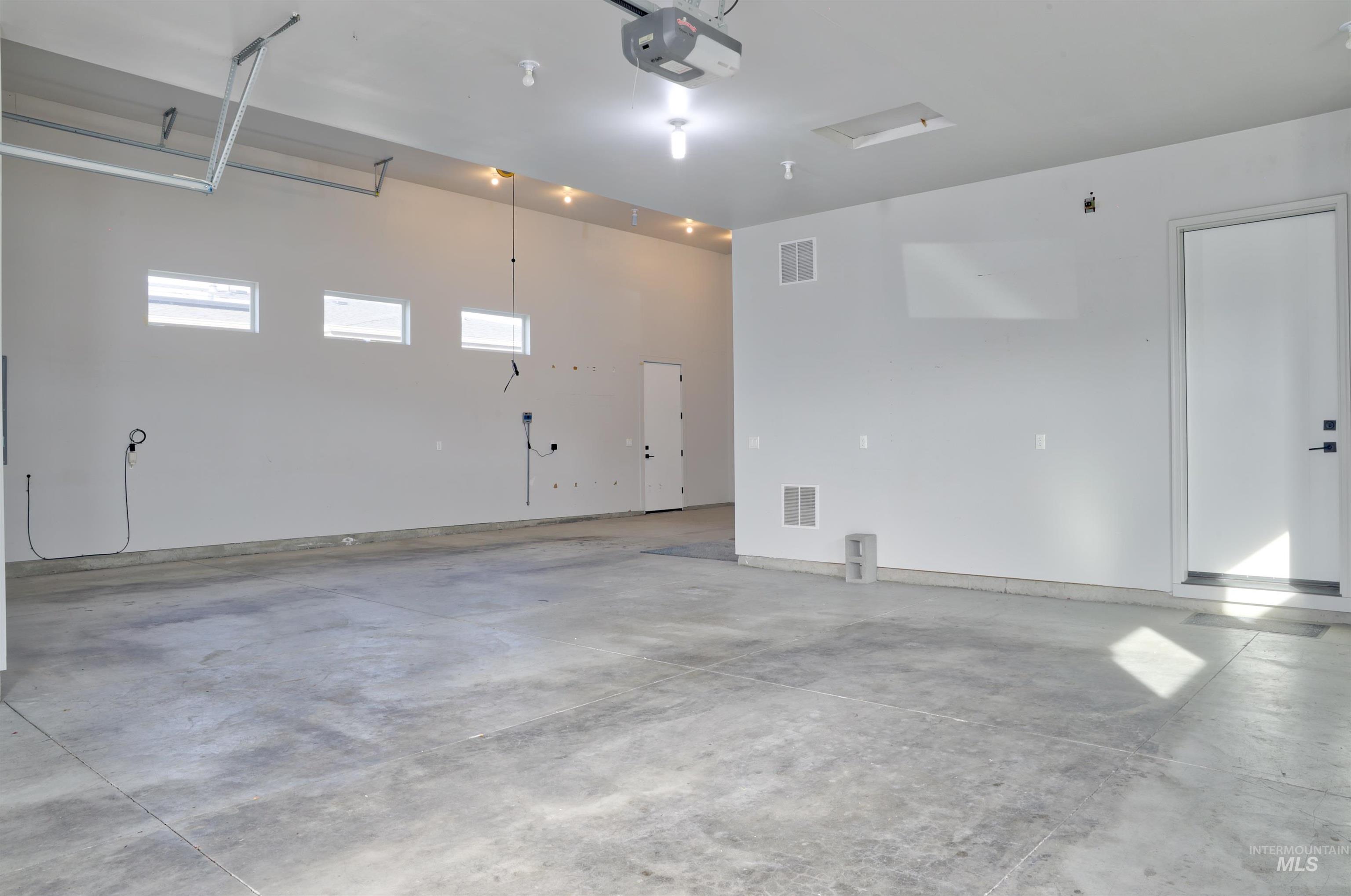 4148 East Copper Point Drive Meridian, ID 83642 - Photo 23 of 26 Garage with a garage door opener