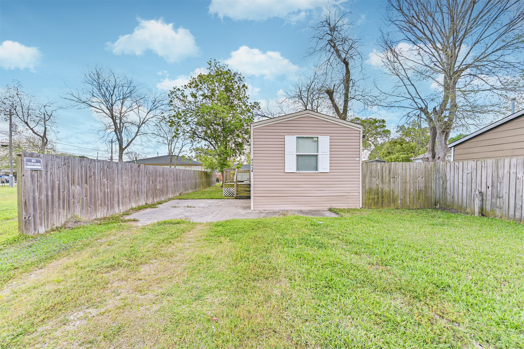 4702 10th Street Bacliff, TX 77518 - Photo 3 of 33 a front view of a house with yard
