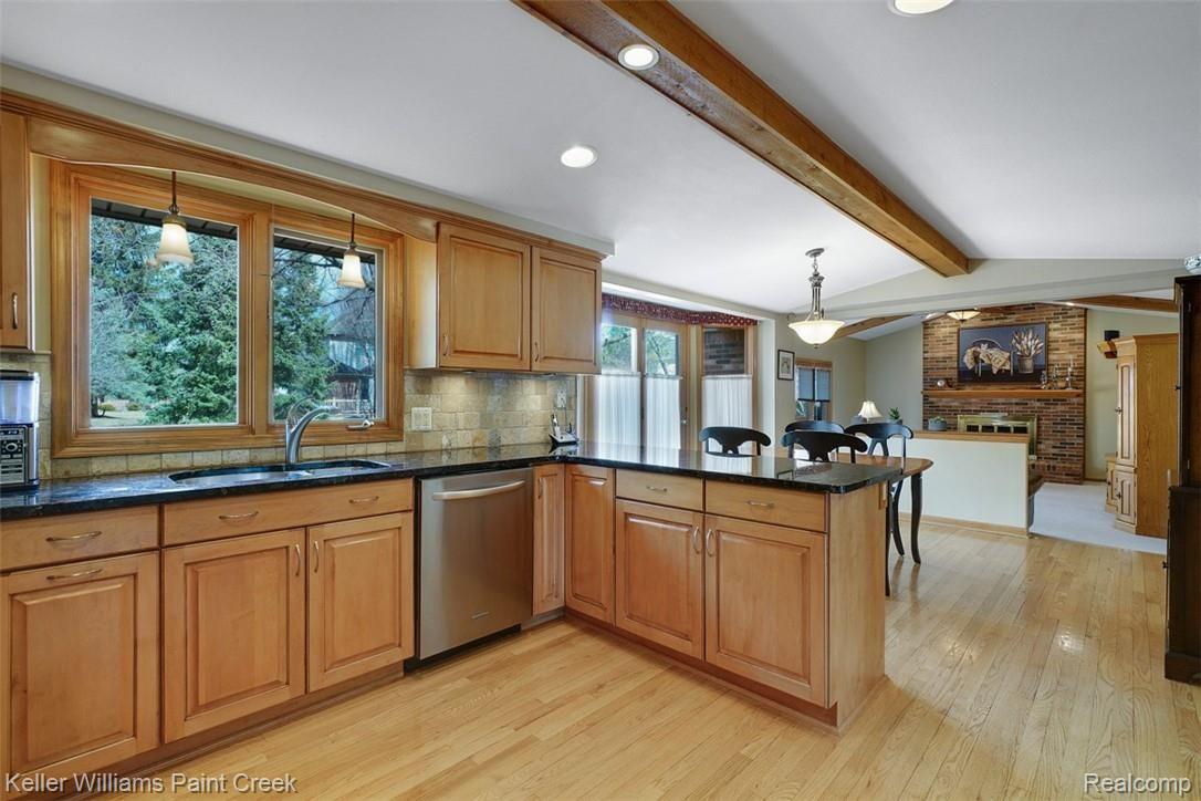 3098 Baypoint Drive Rochester, MI 48309 - Photo 12 of 32 This kitchen is very bright and open making it a joy to cook and entertain in. Great sight lines into the Family Room.