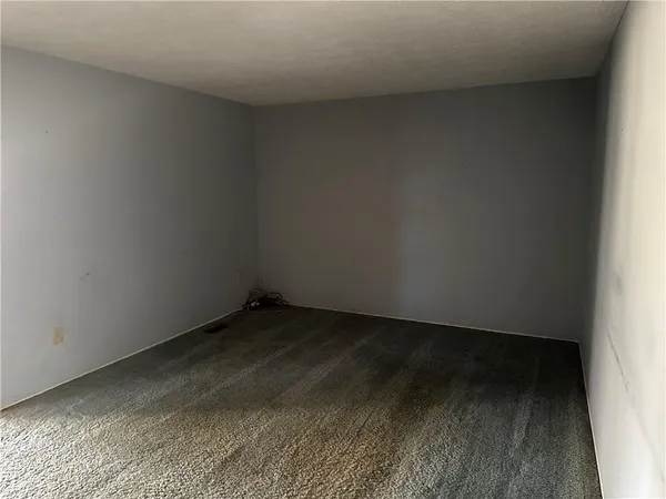 a view of room with wooden floor