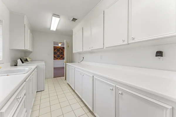 a kitchen with a sink and cabinets