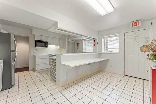 a large white room with mirror