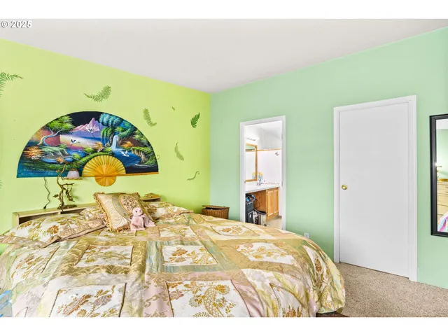 a bedroom with a bed and a dresser