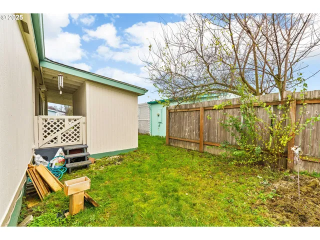 a backyard of a house with lots of green space