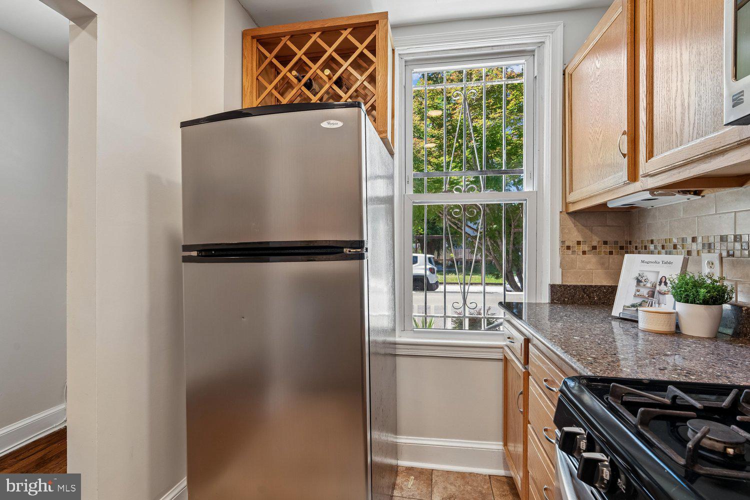 1652 Kramer Street Northeast Washington, DC 20002 - Photo 7 of 26 a kitchen with a refrigerator and a sink