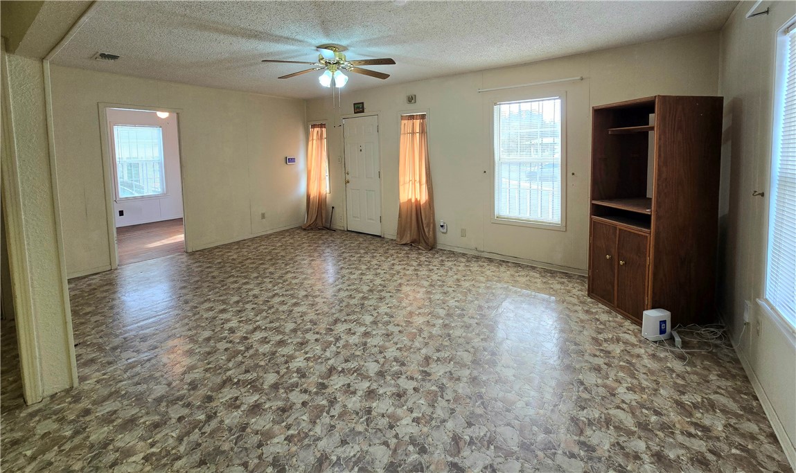 1105 East 5th Street Alice, TX 78332 - Photo 16 of 20 wooden floor in an empty room with a window