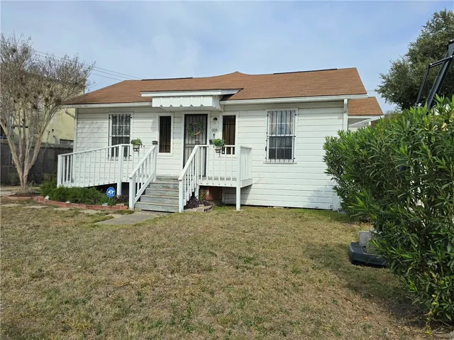 front view of a house with a yard