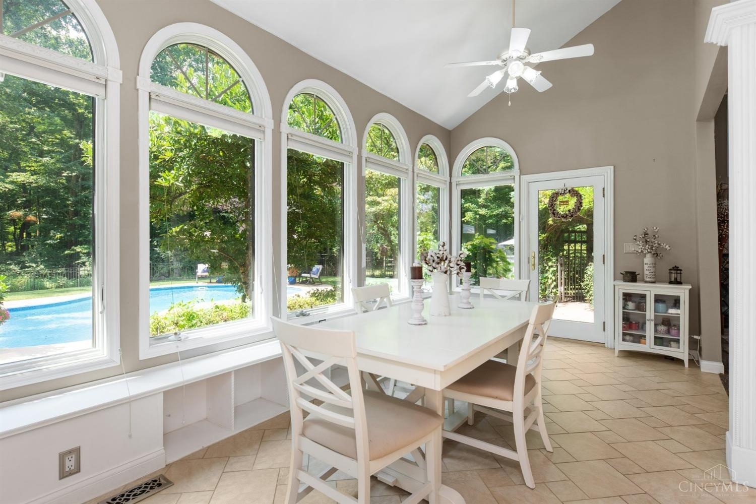 524 Chapel Road Amelia, OH 45102 - Photo 26 of 56 Beautiful wall of windows for extra sunny meals in this breakfast room with views of the inground pool and woods, conveniently accessed with walkout