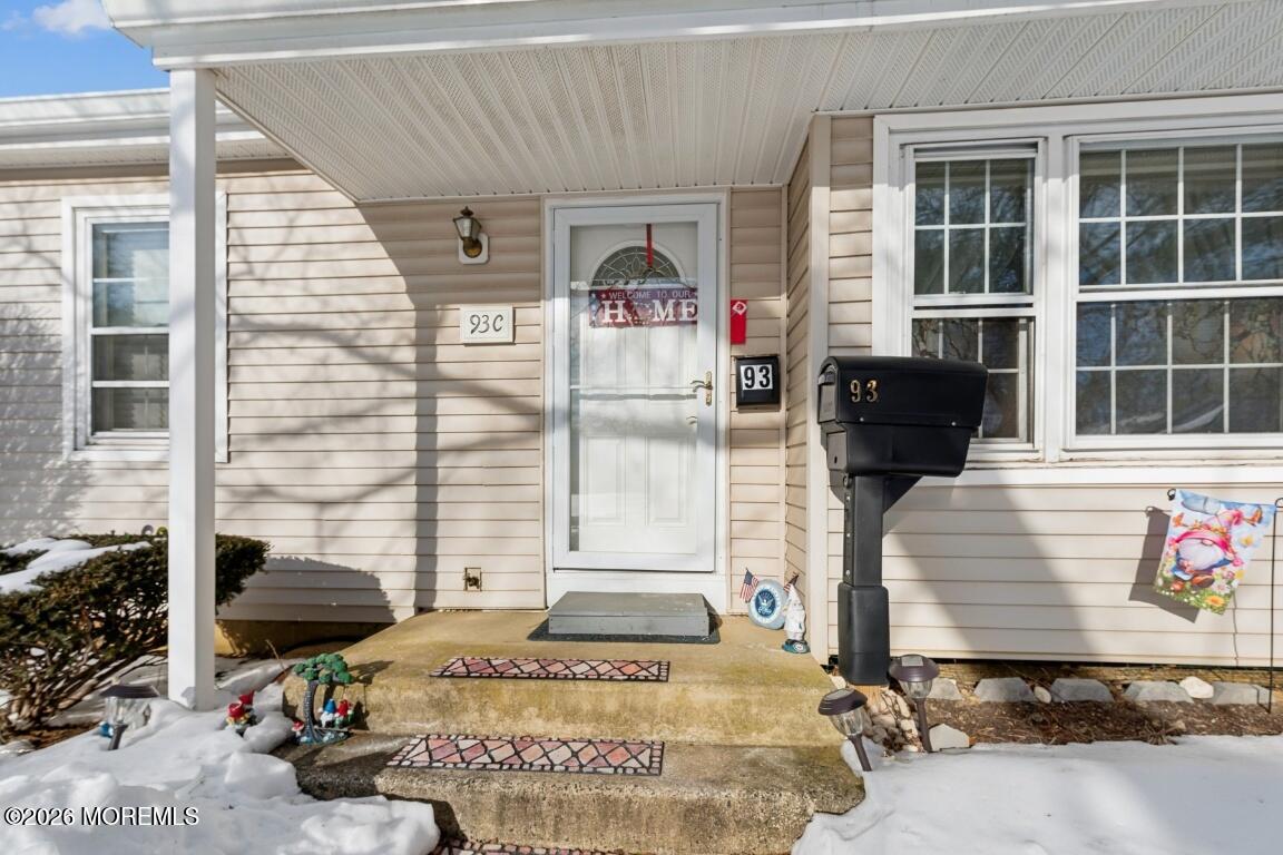 93 Halls Croft Road, Unit C Freehold, NJ 07728 - Photo 14 of 25 a front view of a house with a yard