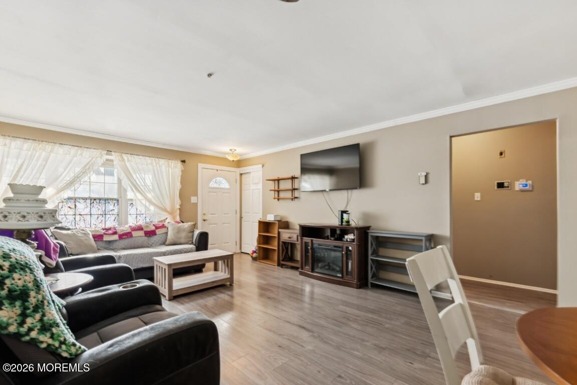 93 Halls Croft Road, Unit C Freehold, NJ 07728 - Photo 18 of 25 a living room with furniture and a large window