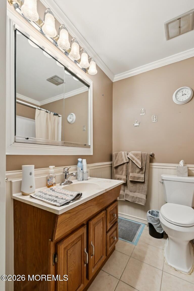93 Halls Croft Road, Unit C Freehold, NJ 07728 - Photo 10 of 25 a bathroom with a granite countertop toilet sink and mirror