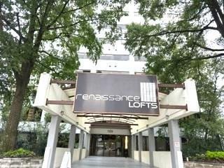 a view of house with sign board and yard