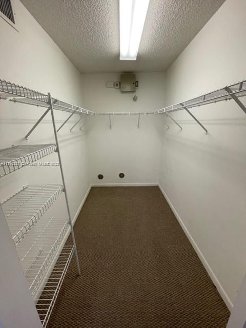 9560 Weldon Circle, Unit J102 Tamarac, FL 33321 - Photo 5 of 7 a view of a room with racks on the wall