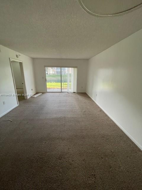9560 Weldon Circle, Unit J102 Tamarac, FL 33321 - Photo 7 of 7 a view of empty room with window