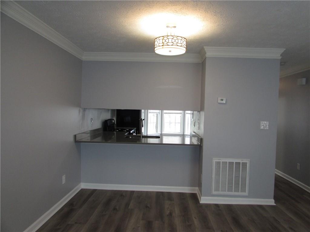 835 Heritage Valley Road Norcross, GA 30093 - Photo 16 of 34 a kitchen with a fridge and a window