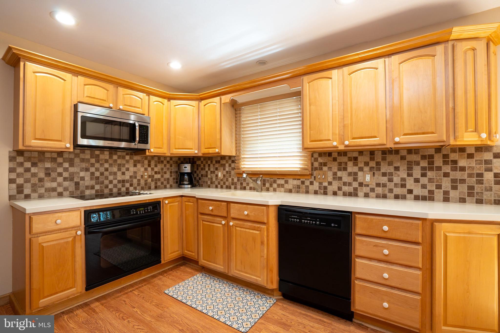 3 Manor Avenue Princeton, NJ 08540 - Photo 11 of 35 a kitchen with granite countertop cabinets stainless steel appliances a sink and a window