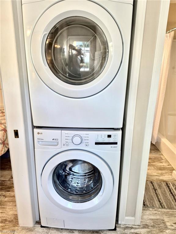 173 Redwood Lane, Unit 8 Naples, FL 34114 - Photo 15 of 19 a utility room with dryer and washer