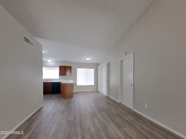 a view of an empty room and a window