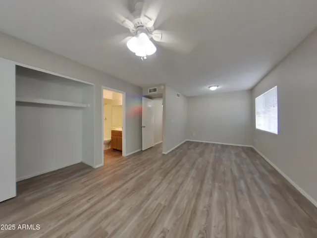 a kitchen with stainless steel appliances granite countertop a refrigerator stove and microwave