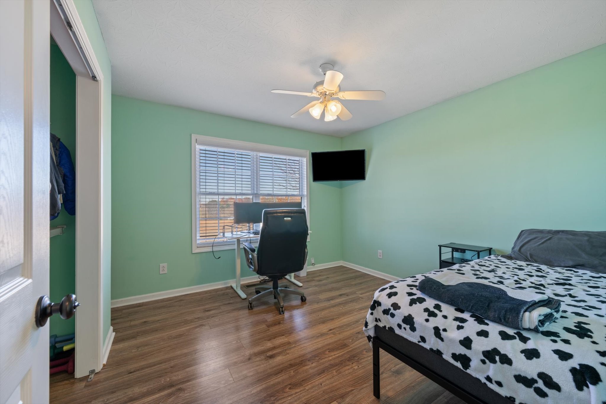 5971 Wayman Dunn Road Springfield, TN 37172 - Photo 17 of 31 a bedroom with a bed and a chandelier