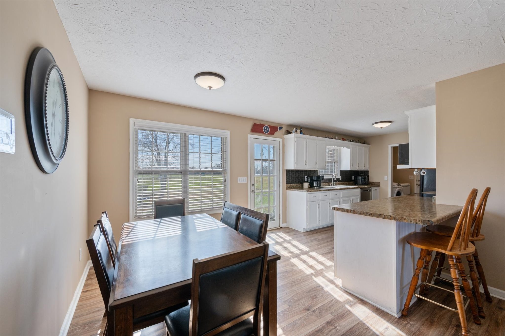 5971 Wayman Dunn Road Springfield, TN 37172 - Photo 8 of 31 a view of a dining room with furniture and a floor to ceiling window