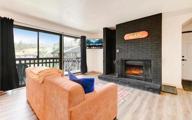 a view of balcony with wooden floor and fence
