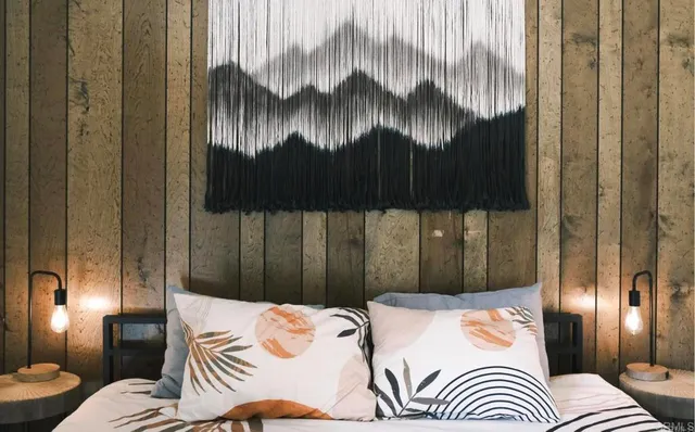 a front view of house with yard and trees around