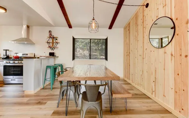 a living room with furniture and a rug