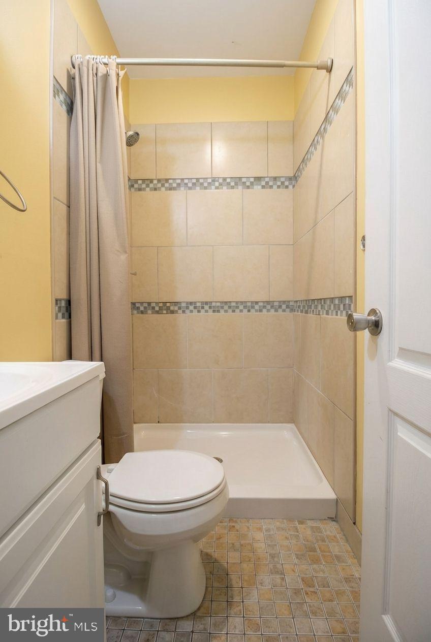 1525 West Seybert Street, Unit A Philadelphia, PA 19121 - Photo 3 of 6 a bathroom with a toilet and a shower