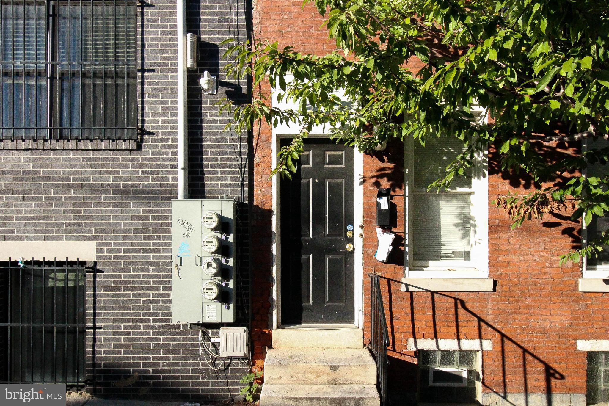 1525 West Seybert Street, Unit A Philadelphia, PA 19121 - Photo 6 of 6 a view of a house with a tree
