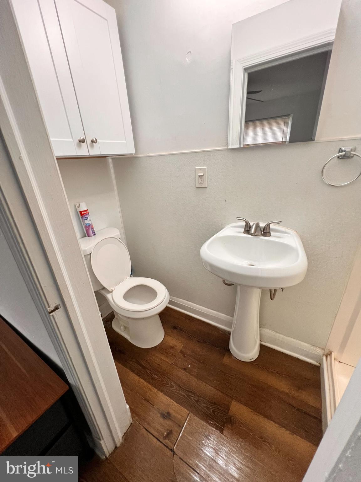8529 Chestnut Oak Road Parkville, MD 21234 - Photo 17 of 23 a bathroom with a sink toilet and a mirror