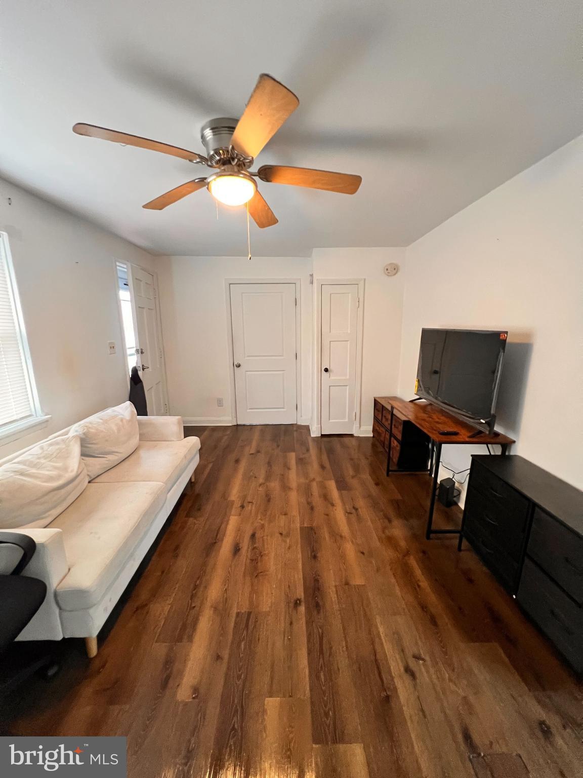 8529 Chestnut Oak Road Parkville, MD 21234 - Photo 6 of 23 a bedroom with a bed and a flat screen tv