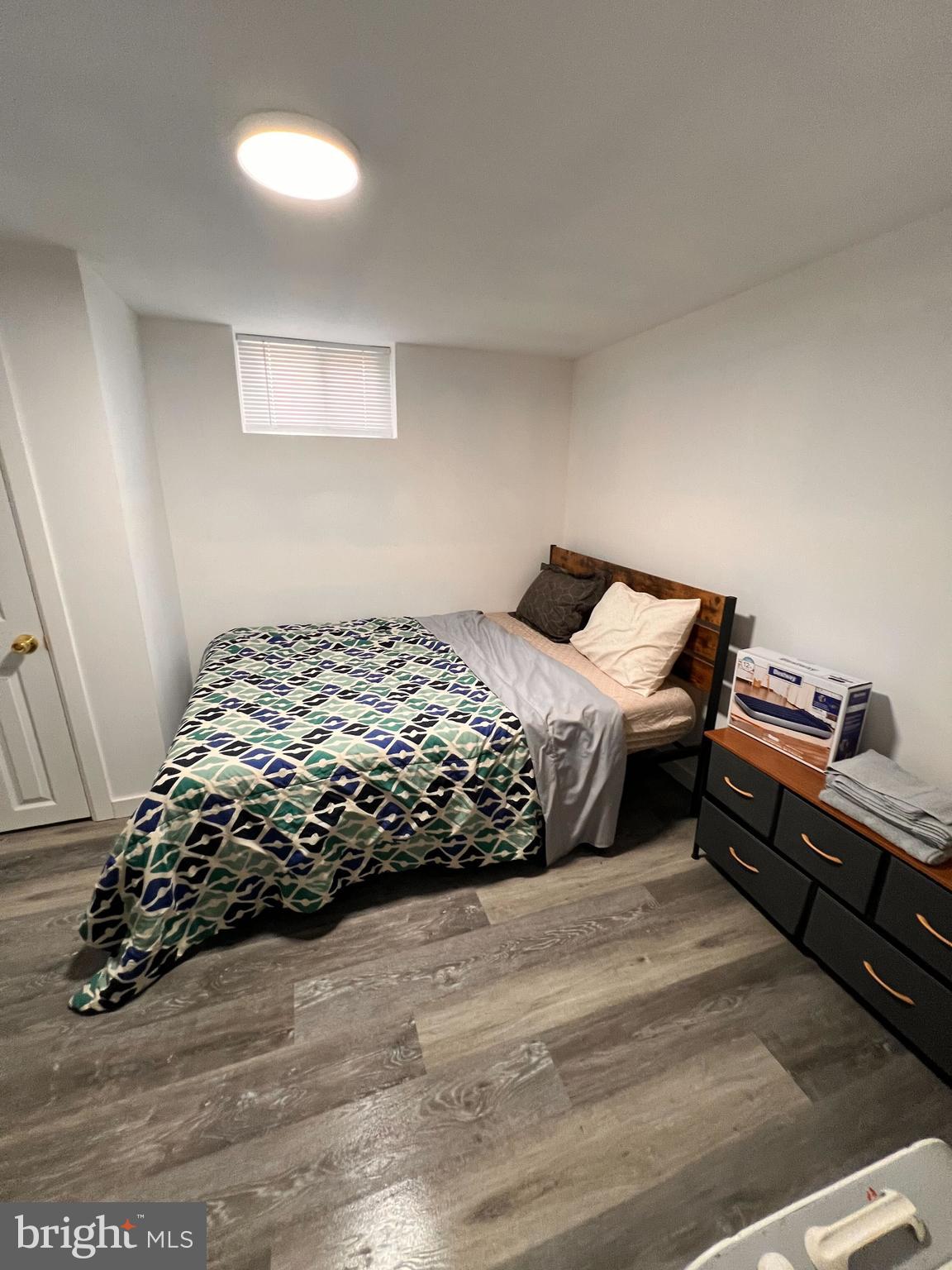 8529 Chestnut Oak Road Parkville, MD 21234 - Photo 8 of 23 a bedroom with a bed and a window