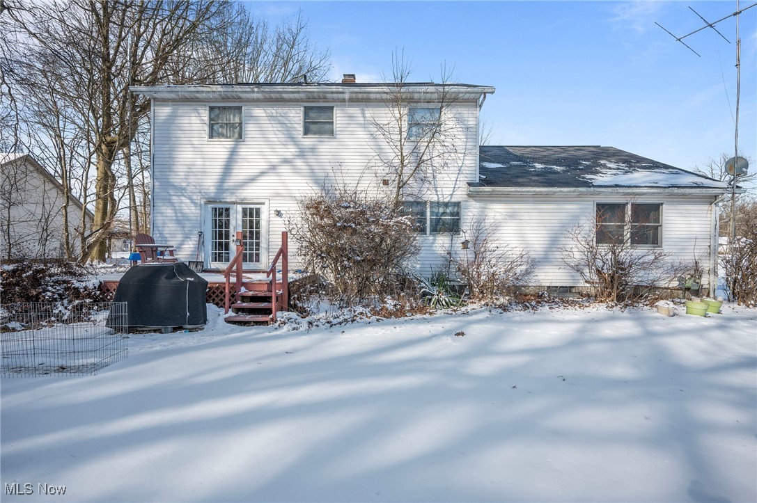 636 Wall Road Wadsworth, OH 44281 - Photo 4 of 35 Snow covered house with french doors and a wooden deck