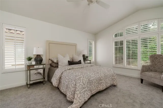 a bedroom with a bed and a desk