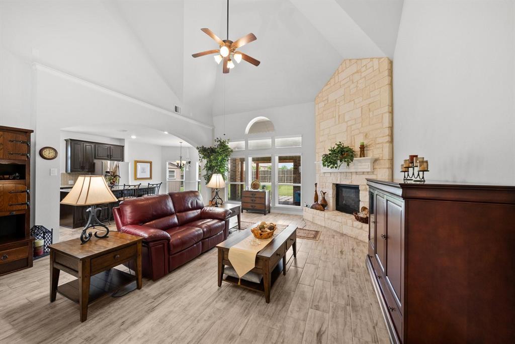 412 Bastrop Road Forney, TX 75126 - Photo 19 of 39 a living room with furniture fireplace and a large window