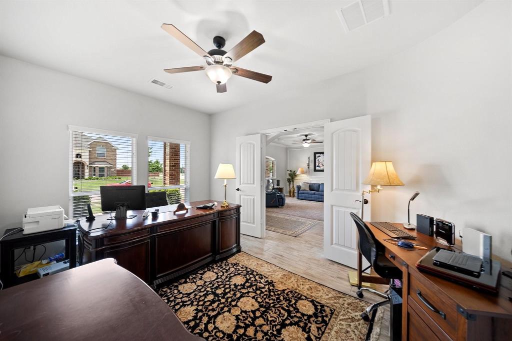 412 Bastrop Road Forney, TX 75126 - Photo 25 of 39 a living room with furniture and wooden floor