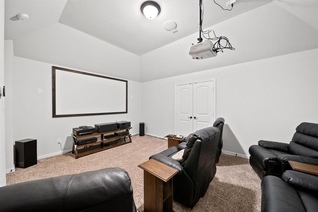 412 Bastrop Road Forney, TX 75126 - Photo 28 of 39 a bedroom with furniture and a wooden floor