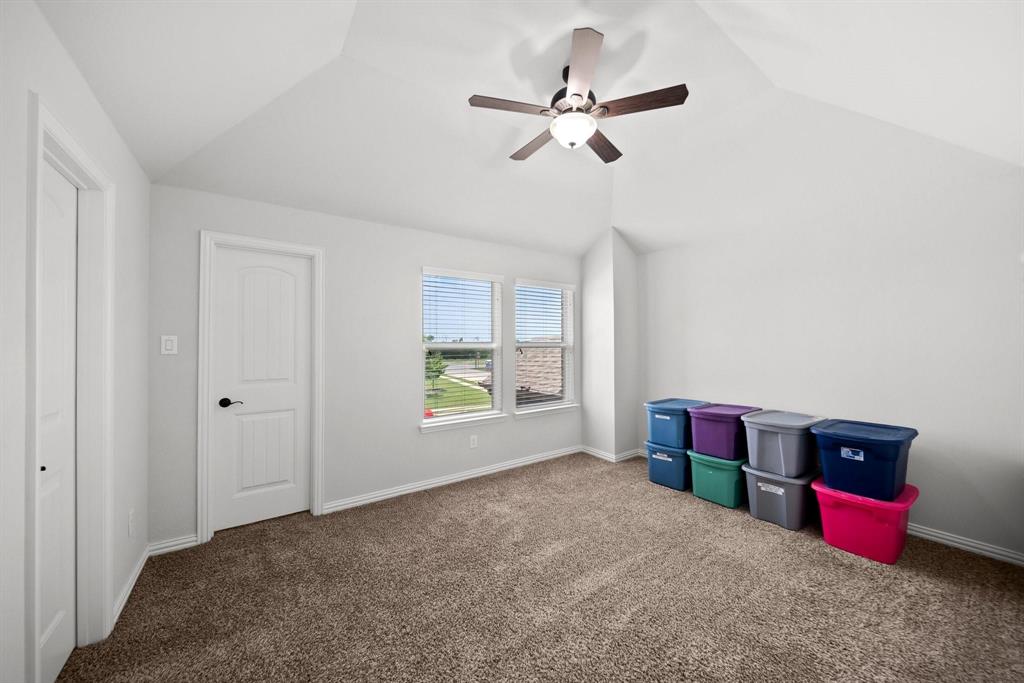 412 Bastrop Road Forney, TX 75126 - Photo 30 of 39 a view of livingroom with furniture window and a ceiling fan