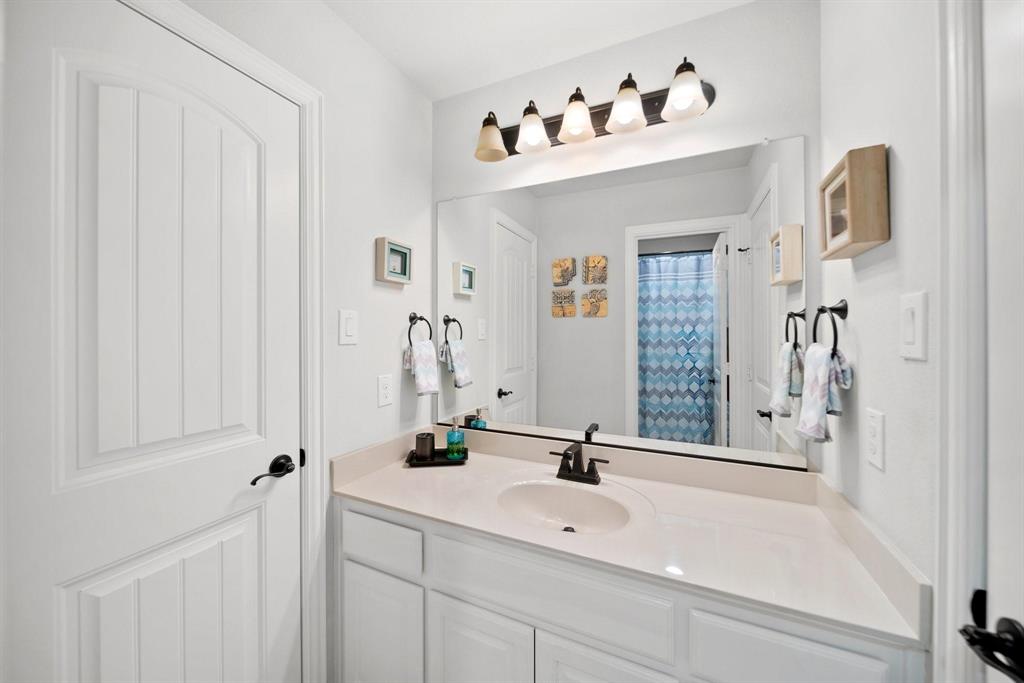 412 Bastrop Road Forney, TX 75126 - Photo 31 of 39 a bathroom with a sink and a mirror