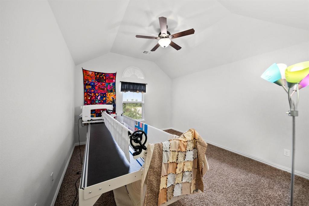 412 Bastrop Road Forney, TX 75126 - Photo 33 of 39 a view of a livingroom with furniture and a ceiling fan