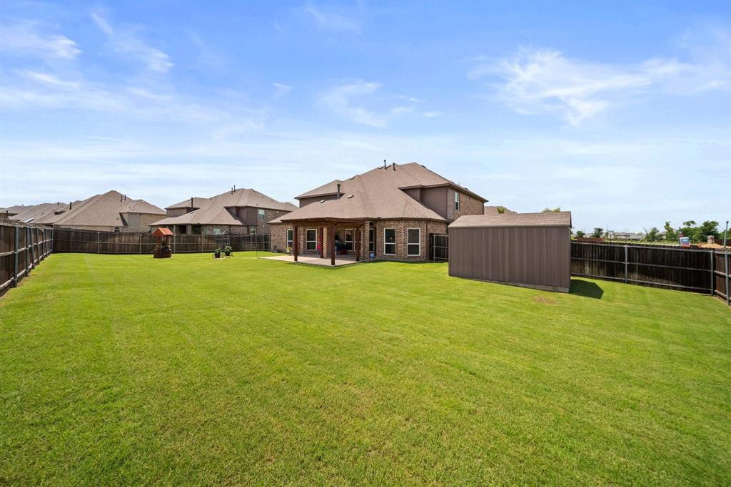 412 Bastrop Road Forney, TX 75126 - Photo 39 of 39 a front view of house with yard and car parked