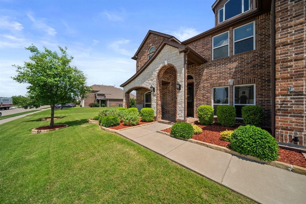 412 Bastrop Road Forney, TX 75126 - Photo 5 of 39 a front view of a house with a yard