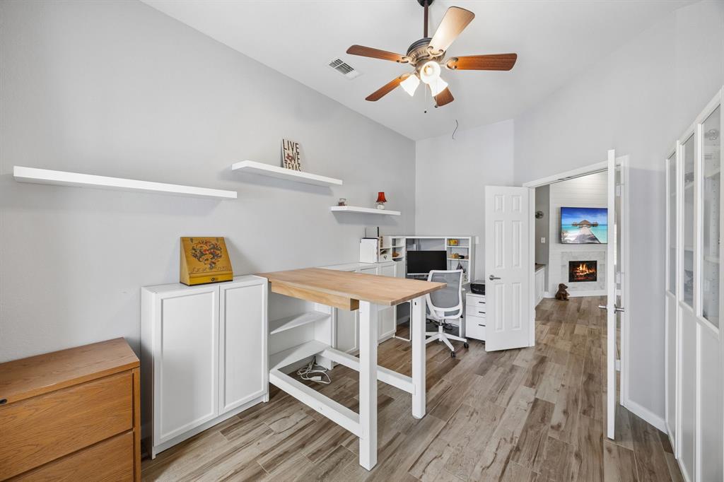 4133 Drexmore Road Fort Worth, TX 76244 - Photo 13 of 31 a view of a kitchen with workspace and wooden floor