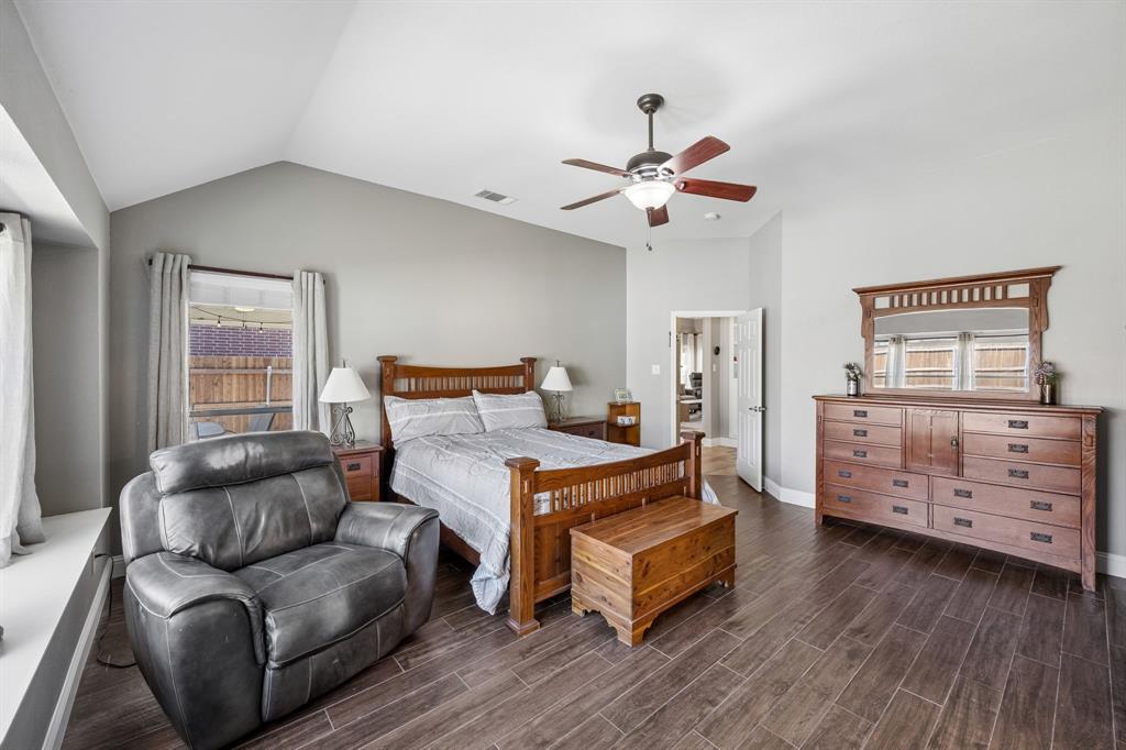 4133 Drexmore Road Fort Worth, TX 76244 - Photo 14 of 31 a bedroom with a bed and wooden floor