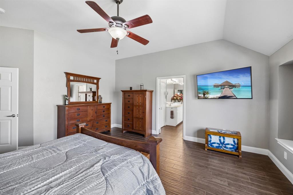 4133 Drexmore Road Fort Worth, TX 76244 - Photo 15 of 31 a bedroom with bed and wooden floor