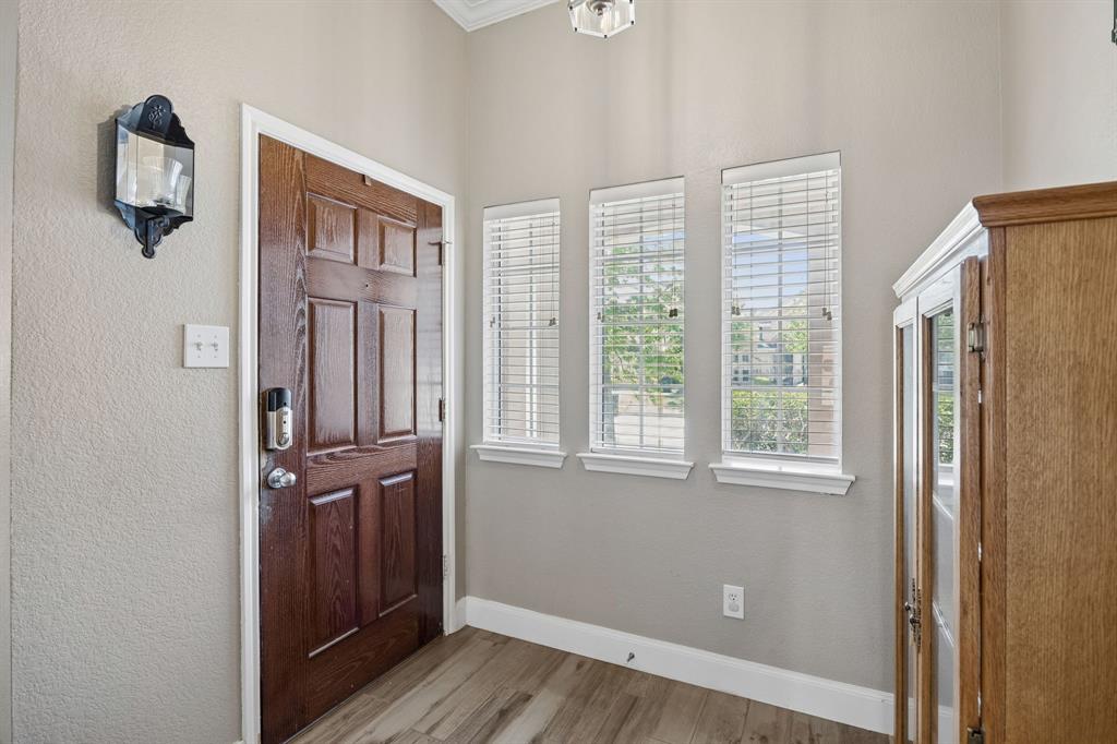 4133 Drexmore Road Fort Worth, TX 76244 - Photo 8 of 31 an entryway of a house with wooden floor and windows